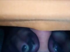 Busty woman is rubbing dick with her feet while playing with her huge milk jugs