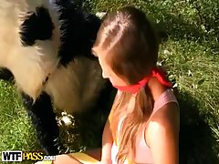Lovely teen was tied up in the forest and fucked from the back by a Panda toy