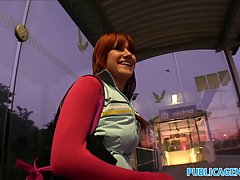 While she was waiting the train, red haired babe found an interesting way to warm herself up