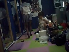 Japanese teen is rubbing her nice tits and wet pussy, while sitting on the floor