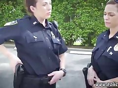 Chubby police woman is sucking a skinny black guy's dick, while kneeling in front of him