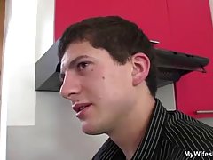 Mature blonde woman seduced her son's friend and had casual sex with him in the kitchen