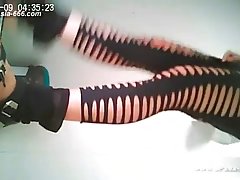 Chinese girls were peeing in a public toilet not knowing about a hidden camera placed there