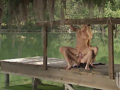 Hot blonde is having sex outdoors, not knowing that someone is secretly watching her in action